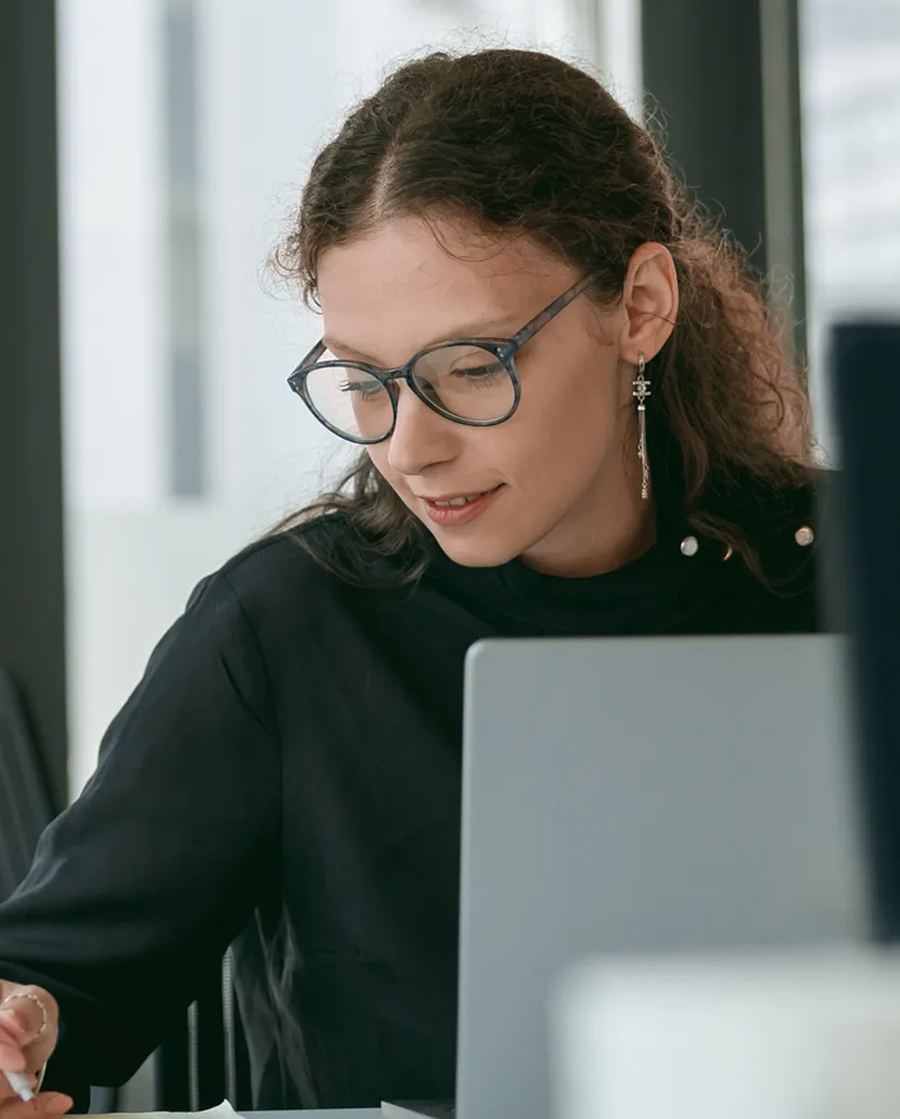 A Sope consultant working through a real task with a client at her laptop