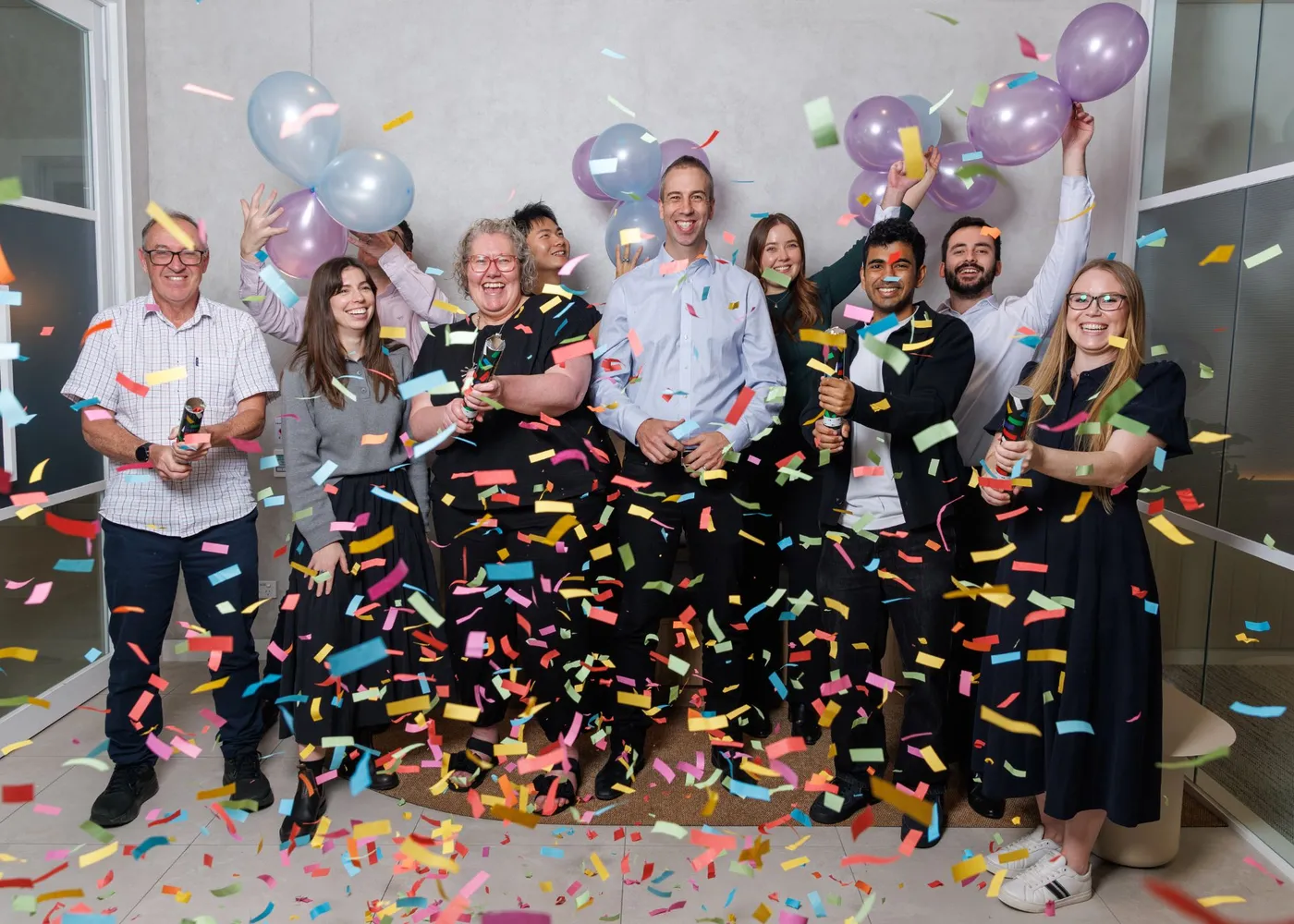 The Sope team celebrating with confetti and balloons